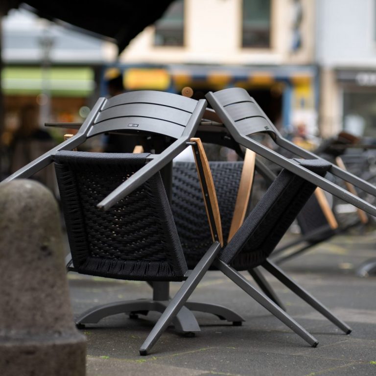 black and brown steel armchairs