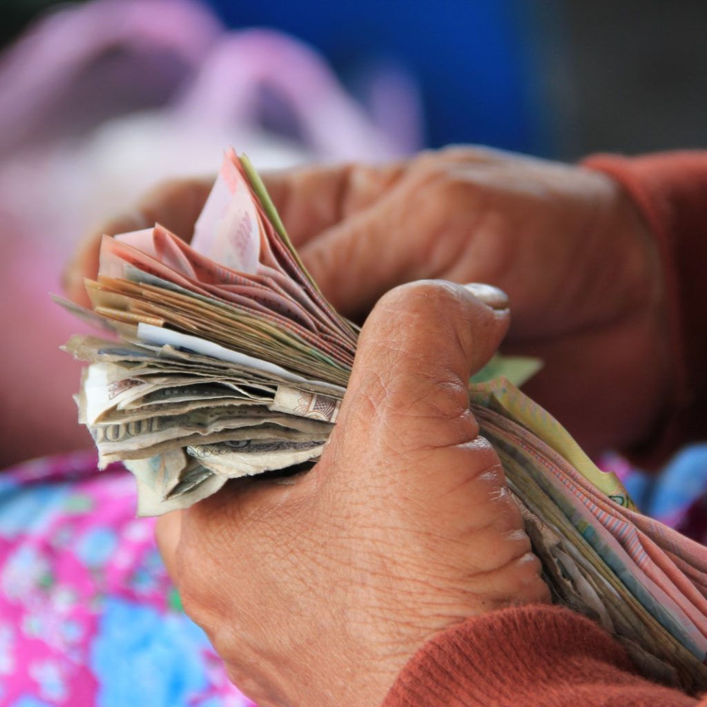 person holding banknotes